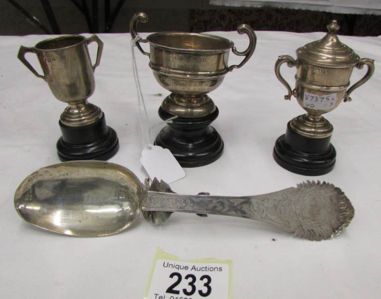 An ornate Georgian silver spoon and 3 miniature trophy cups hallmarked Birmingham, 1922-1923,