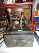 A small antique sewing machine by James G. Weir of London.