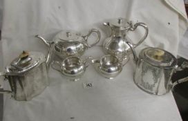 A 4 piece Walker & Hall silver plate tea service and 2 silver plate teapots.