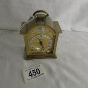 A miniature 'Swiza' brass carriage clock.