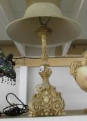 A classical style table lamp with shade.