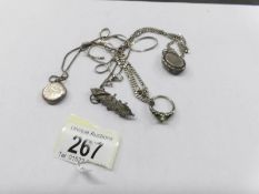 A mixed lot of silver lockets, chains, brooch, etc.