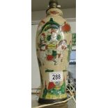A Chinese crackle glaze vase converted to a table lamp with character marks.