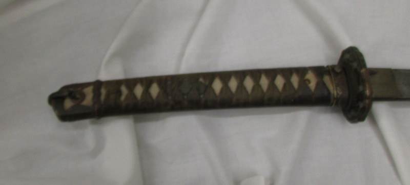 A 19th century Japanese sword in sheath. - Image 2 of 4