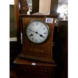 An Edwardian mahogany inlaid mantel clock, in working order and with key.