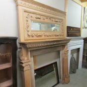 A large Victorian fire surround with over mantel mirror.