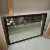 A mahogany framed mirror.