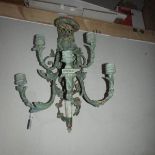A metal wall mounting candle holder.