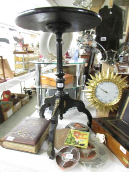 An ormolu mounted tripod table.