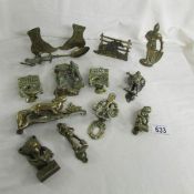A collection of brass door knockers, etc.