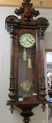 A Victorian mahogany twin weight Vienna wall clock.