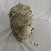 A carved stone lions head.