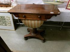 A Victorian rosewood sewing table.