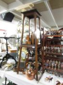 A tall oak plant stand.