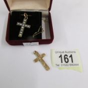 A vintage pearl set cross in gold tested together with a further cross in 9ct gold.