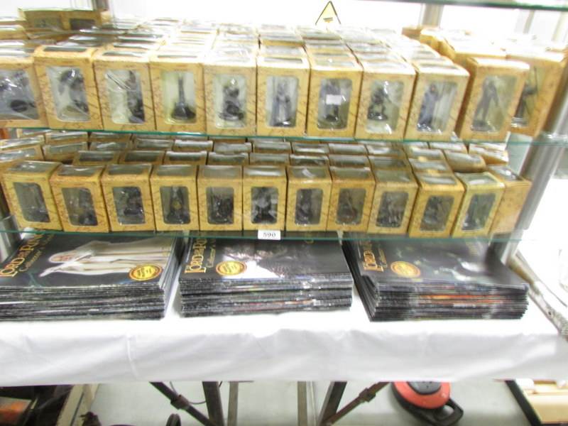 A large collection of Lord of the Rings painted lead models (180) together with magazines issues 1