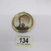A Georgian sweetheart pendant of finely worked hair with monogram on mother of pearl,