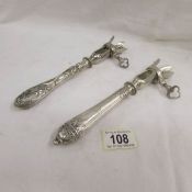 Two French ham bone holders with silver handles, circa 1900 with French hall mark.