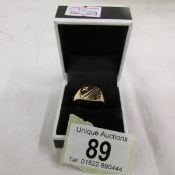 A gentleman's signet ring set with a diamond in 9ct gold, size R.