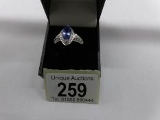 A 14ct gold tanzanite and diamond ring, size T.