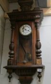 A Victorian mahogany wall clock.