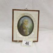 A framed oval miniature portrait of a gentleman.