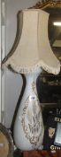 A Victorian milk glass gilded table lamp.