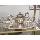 An ornate 3 piece chased Sheffield plate tea set on tray,.