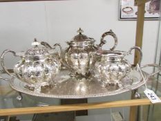 An ornate 3 piece chased Sheffield plate tea set on tray,.