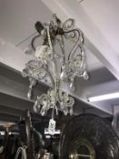 A small chandelier style ceiling light.