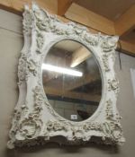 An ornate framed mirror.