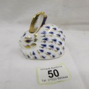 A Royal Crown Derby rabbit paperweight with gold stopper.