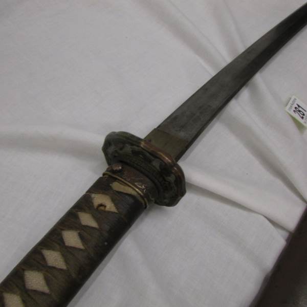 A 19th century Japanese sword in sheath. - Image 3 of 4