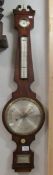 A Victorian mahogany wheel barometer with silvered dial.