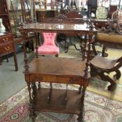 A Victorian 3 tier walnut Canterbury with central drawer.