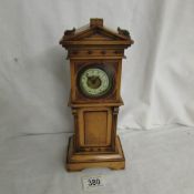 A miniature Grandfather clock.