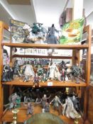 Approximately 25 Lord of the Rings figures.