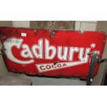 A red enamel 'Cadbury' sign.