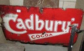 A red enamel 'Cadbury' sign.