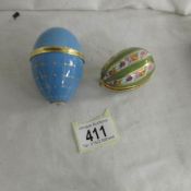 2 good quality hand painted egg trinket boxes including one with silver mount and painted ship