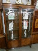 A mahogany display cabinet.