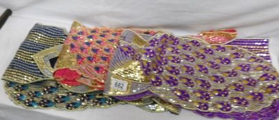 A quantity of sequin decorated stoles.