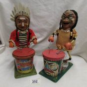 A battery operated Marx Nutty Mad Indian and a 'TN' Nomora Indian, both playing a drum.