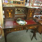 A rosewood ladies inlaid desk with brass gallery.