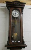 A Victorian single weight Vienna wall clock.