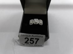 A large 3 panel 18ct white gold ring set baguette diamonds, size O.