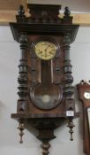 A mahogany wall clock.