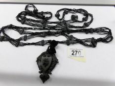 2 Whitby jet necklaces/muff chains and a Whitby jet opening locket.