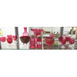 A mixed lot of cranberry glass.