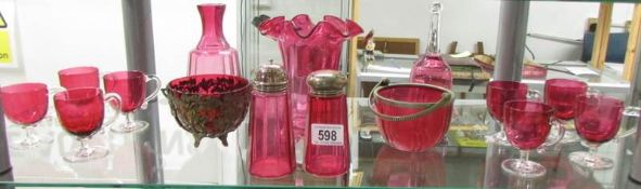 A mixed lot of cranberry glass.